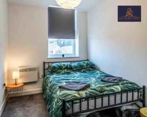 a bedroom with a bed and a window at Swan House Apartment 4 - 1 Bed Apartment - Sleeps up to 4 - Free Parking - Liverpool - close to city centre - By ALL ELITE STAYS in Liverpool