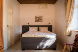 Postel nebo postele na pokoji v ubytování Villa Meretare