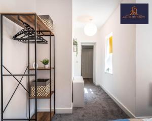 a hallway with a staircase in a house at Swan House Stunning 1 bed Apartment By ALL ELITE STAYS - near Liverpool city centre - Sleeps 4 - Free Parking in Liverpool