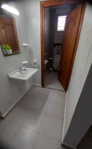 a bathroom with a sink and a toilet at Villa Karim in Nabeul