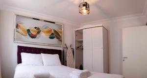 a bedroom with a bed and a mirror at Fully Equiped Apartment In Istanbul Avcilar - Zarif-60 in Avcılar
