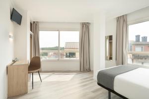 Μια τηλεόραση ή/και κέντρο ψυχαγωγίας στο Hotel Alda Camiño Inglés