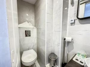 a white bathroom with a toilet and a sink at Sweet Home Marceau 6 studios hyper centre proche de la mer et du palais in Cannes