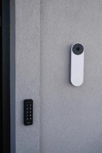 a remote control on a wall next to a wall at Aldoar House in Porto