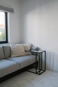 a living room with a couch and a table at Aldoar House in Porto