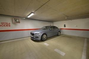 a car parked in a parking lot in a garage at Wilson Palace in Bratislava