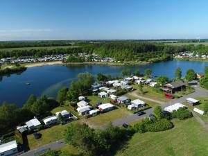 an aerial view of a campground on a lake at Luxuswohnwagen Karpfen am Kransburger See 354 in Kransburg