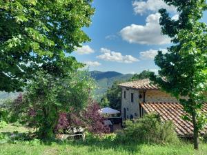 a house with a view of the mountains at Valle Dame in Cortona