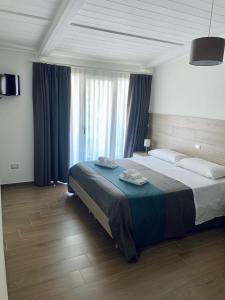 Letto o letti in una camera di Tempio Aurora
