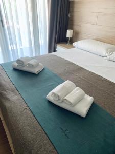 Letto o letti in una camera di Tempio Aurora
