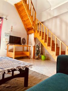a living room with a staircase and a television at El-sheikh Salem villa in Dahab +29 photos