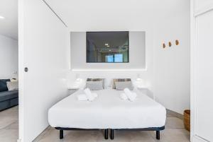 A bed or beds in a room at MEDANO4YOU Charly Blau