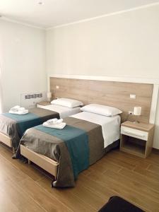 Letto o letti in una camera di Tempio Aurora