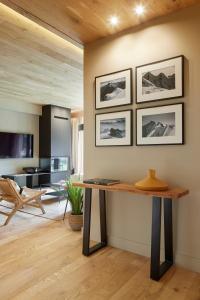 a room with a table and a living room at Jardí d'Arties by FeelFree Rentals in Arties