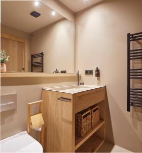 a bathroom with a sink and a mirror at Jardí d'Arties by FeelFree Rentals in Arties +23 photos