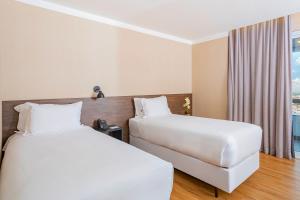 NH HOTEL FEIRA DE SANTANA客房内的一张或多张床位