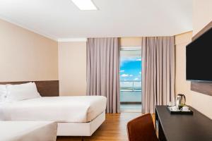 NH HOTEL FEIRA DE SANTANA客房内的一张或多张床位