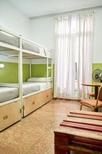 A bed or beds in a room at LOFT HOSTAL Group