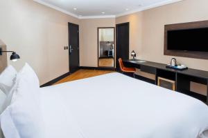NH HOTEL FEIRA DE SANTANA客房内的一张或多张床位