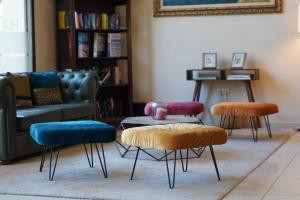 a living room with three chairs and a couch at Hotel Espanya by ALEGRIA in Calella