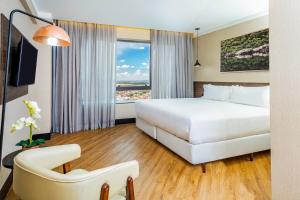 NH HOTEL FEIRA DE SANTANA客房内的一张或多张床位