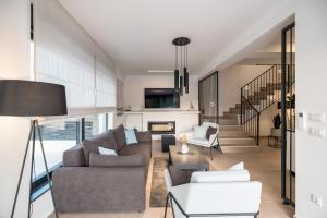 a living room with a couch and a table at Villa Levant in Murter