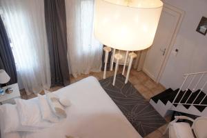 Postel nebo postele na pokoji v ubytování Guesthouse Le Mas de Cotignac