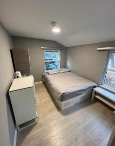 a small bedroom with a bed and a window at Sterne Street in London