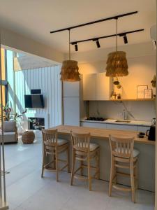 a kitchen with a wooden table and chairs at Mono house kartepe in Kocaeli