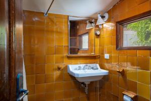 a bathroom with a sink and a mirror at Flateli Sa Tuna 4 in Begur +30 photos