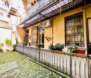 a building with potted plants on the side of it at Loft B in Turin