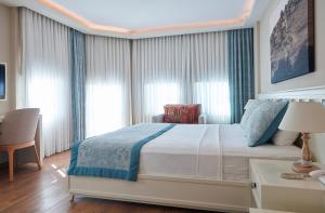 Postel nebo postele na pokoji v ubytování Meydani Butik Hotel