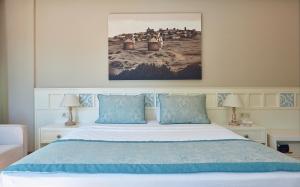 Postel nebo postele na pokoji v ubytování Meydani Butik Hotel