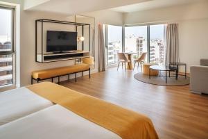 a hotel room with a bed and a television at Arrecife Gran Hotel & Spa in Arrecife