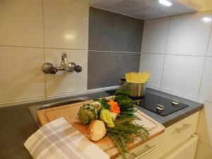 Kuchyň nebo kuchyňský kout v ubytování Apartments Lodra