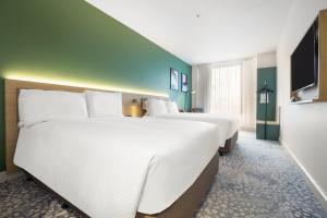 Postel nebo postele na pokoji v ubytování Holiday Inn Dandenong by IHG