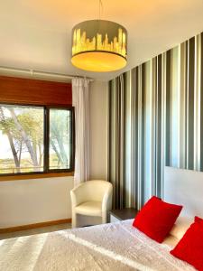 A bed or beds in a room at Apartamentos Montalvo Leiro