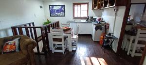 a kitchen with a table and chairs in a room at Sable Sunset Guesthouse in Trichardt