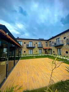 a large brick building with a large courtyard at MELİTYA HOTELS Gökçeada in Kalekoy