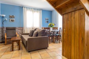 a living room with a couch and a table at La Borda de Marco in Gavín