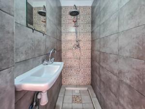 a bathroom with a sink and a shower at Riad MIYA in Essaouira