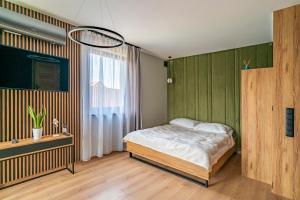 Apartamenty i Pokoje Złote Piaski客房内的一张或多张床位