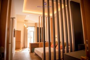 a bedroom with a bed with a crib in it at Belladonna Luxury Apartment in Cava deʼ Tirreni +27 photos