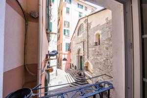 a view of an alley from a balcony of a building at Affittacamere La Città Vecchia in Genova