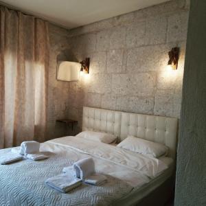 Postel nebo postele na pokoji v ubytování Asma Altı Cave