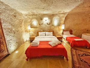 Postel nebo postele na pokoji v ubytování Asma Altı Cave