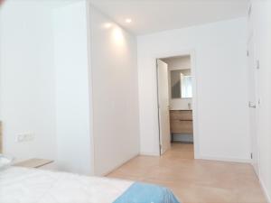 Postel nebo postele na pokoji v ubytování Residencial El Trenet 2A