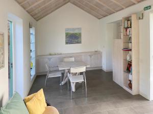 a dining room with a table and chairs at Almendro in Puntagorda