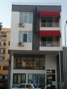 a building with a car parked in front of it at Bo homes suıt apart in Demre