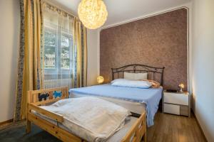 Postel nebo postele na pokoji v ubytování Villa Vittoria Mountain View